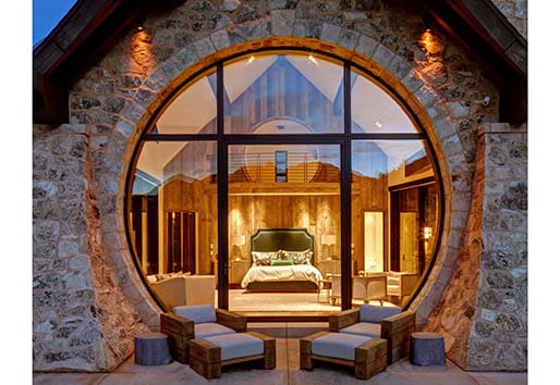 Utah mountain home with Andersen pivot door and specialty rounded windows